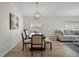 Dining area with chandelier, hardwood floors and natural light at 3018 Andover Ct, Mount Dora, FL 32757