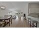 Open floor plan seamlessly connects the living and dining areas, perfect for entertaining at 3018 Andover Ct, Mount Dora, FL 32757