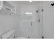 Modern glass enclosed shower with white tiled walls and rainfall shower head at 3018 Andover Ct, Mount Dora, FL 32757