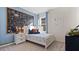 Bedroom with a twin bed, chalkboard accent wall, and blue curtains at 3121 Partington Blvd, Davenport, FL 33837