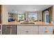 Open-concept kitchen featuring a large island, stainless steel dishwasher, and modern fixtures at 3121 Partington Blvd, Davenport, FL 33837