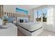 Bright main bedroom with a large window, modern decor, and a comfortable queen-sized bed at 3121 Partington Blvd, Davenport, FL 33837