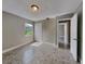 Neutral bedroom with a closet, tile flooring, and views to another room at 3220 Mahalia Pl, Orlando, FL 32805