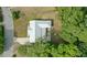 Overhead aerial view of the house, driveway, and surrounding greenery at 368 E Chelsea St, Deland, FL 32724