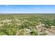 Aerial view of home surrounded by mature trees and landscaping providing privacy at 368 E Chelsea St, Deland, FL 32724