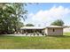 Backyard view showcasing the homes well-maintained lawn and surroundings at 368 E Chelsea St, Deland, FL 32724