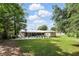 Spacious backyard with screened in patio and gravel area at 368 E Chelsea St, Deland, FL 32724