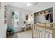 Well-lit Bedroom with window, crib, and closet boasting ample storage space at 368 E Chelsea St, Deland, FL 32724