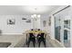 Light dining room features a chandelier and a sliding glass door at 368 E Chelsea St, Deland, FL 32724