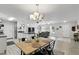 Open floor plan showing dining area and kitchen with granite countertops at 368 E Chelsea St, Deland, FL 32724