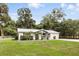 Charming single story home featuring a manicured lawn and lovely front porch seating area at 368 E Chelsea St, Deland, FL 32724