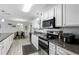 The kitchen features stainless appliances and granite countertops at 368 E Chelsea St, Deland, FL 32724