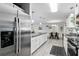 Stainless refrigerator with a view into the dining room and kitchen at 368 E Chelsea St, Deland, FL 32724