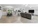 Open concept living room and kitchen featuring modern finishes, tile floors, and natural light at 368 E Chelsea St, Deland, FL 32724
