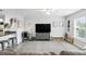 Bright living room featuring a cozy seating area and contemporary decor at 368 E Chelsea St, Deland, FL 32724