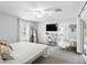 Light and airy main bedroom featuring large window, ceiling fan, and ensuite bathroom with shower at 368 E Chelsea St, Deland, FL 32724