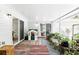 Covered porch featuring a play house, and a variety of potted plants at 368 E Chelsea St, Deland, FL 32724