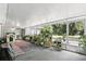 Spacious covered porch with views of the yard, and multiple potted plants at 368 E Chelsea St, Deland, FL 32724