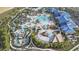Aerial view of the resort-style community pool and water park featuring slides and relaxation areas at 3806 Lana Ave, Davenport, FL 33897