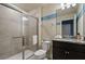 The bathroom features a large shower, toilet, and granite topped vanity with a mirror at 3806 Lana Ave, Davenport, FL 33897