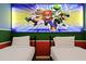 The playful bedroom has an accent wall featuring iconic Mario and friends with two twin beds at 3806 Lana Ave, Davenport, FL 33897
