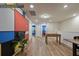Large game room features foosball table and colorful accent wall, and plenty of natural light at 3806 Lana Ave, Davenport, FL 33897
