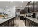 Stylish kitchen featuring granite countertops, stainless steel appliances, and ample cabinet space at 3806 Lana Ave, Davenport, FL 33897