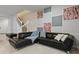 Comfortable living room with a large sofa, throw blanket, pillows and a unique square panel art accent at 3806 Lana Ave, Davenport, FL 33897