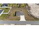 An aerial view showing the layout of the home, driveway, and surrounding yard at 4743 Sw 114Th Pl, Ocala, FL 34476