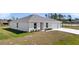 New construction featuring a neutral color scheme, well-manicured landscaping and an attached two-car garage at 4743 Sw 114Th Pl, Ocala, FL 34476