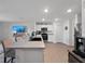 Open-concept kitchen featuring a large island, stainless steel appliances, and modern finishes at 4743 Sw 114Th Pl, Ocala, FL 34476
