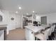 Bright, open kitchen featuring a large island with seating and stainless steel appliances at 4743 Sw 114Th Pl, Ocala, FL 34476