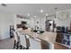 Bright, open kitchen featuring a large island with seating and modern appliances at 4743 Sw 114Th Pl, Ocala, FL 34476