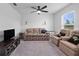 Inviting living room with a sofa, ceiling fan, and a window at 4743 Sw 114Th Pl, Ocala, FL 34476
