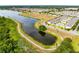 Aerial shot featuring a large lake, walking paths, and a neatly arranged residential area at 4801 Apple Blossom Ln, St Cloud, FL 34771