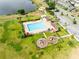 An aerial view highlighting the community pool and playground area of a Gathering-friendly neighborhood at 4801 Apple Blossom Ln, St Cloud, FL 34771