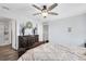Bedroom features wood floors, ceiling fan, with dark wood furniture, and neutral paint at 4801 Apple Blossom Ln, St Cloud, FL 34771
