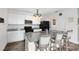 Modern kitchen with granite countertops, white cabinets, and stainless steel appliances at 4801 Apple Blossom Ln, St Cloud, FL 34771