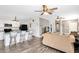 Open-concept living area with a kitchen island and barstool seating at 4801 Apple Blossom Ln, St Cloud, FL 34771