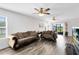 Spacious living room with hardwood floors and plush seating arrangement at 4801 Apple Blossom Ln, St Cloud, FL 34771