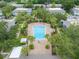 Aerial view showcasing a pool surrounded by lush landscaping and residential buildings at 4820 S Conway Rd # 131, Orlando, FL 32812