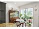 Cozy dining space with stylish decor, including a large window adorned with indoor plants at 4820 S Conway Rd # 131, Orlando, FL 32812
