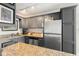 A corner kitchen showing stainless steel appliances and countertops at 4820 S Conway Rd # 131, Orlando, FL 32812