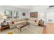 Comfortable living room with neutral tones, a large window, and stylish decor at 4820 S Conway Rd # 131, Orlando, FL 32812