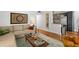 Inviting living room with comfortable seating and a view of the kitchen area at 4820 S Conway Rd # 131, Orlando, FL 32812