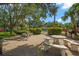 Outdoor picnic area featuring stone tables, benches, and a grill, perfect for gatherings at 4820 S Conway Rd # 131, Orlando, FL 32812
