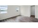 Bedroom with beautiful light from two large windows showcasing lake views at 5227 Ligonberry St, Lakeland, FL 33811