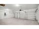 This garage features a two-car garage door and an automatic opener at 5227 Ligonberry St, Lakeland, FL 33811