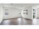 Spacious living room featuring wood-look floors, bright windows, and sliding glass doors to outdoor space at 5227 Ligonberry St, Lakeland, FL 33811