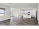 Open layout of living room and bright modern kitchen with view of the lake at 5227 Ligonberry St, Lakeland, FL 33811